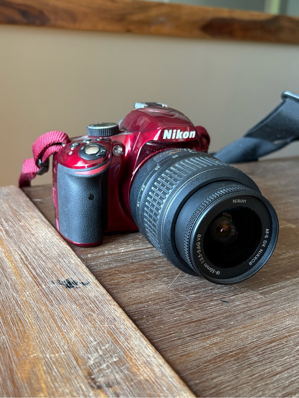Nikon Red DSLR with 18-55mm Lens and Black Grip